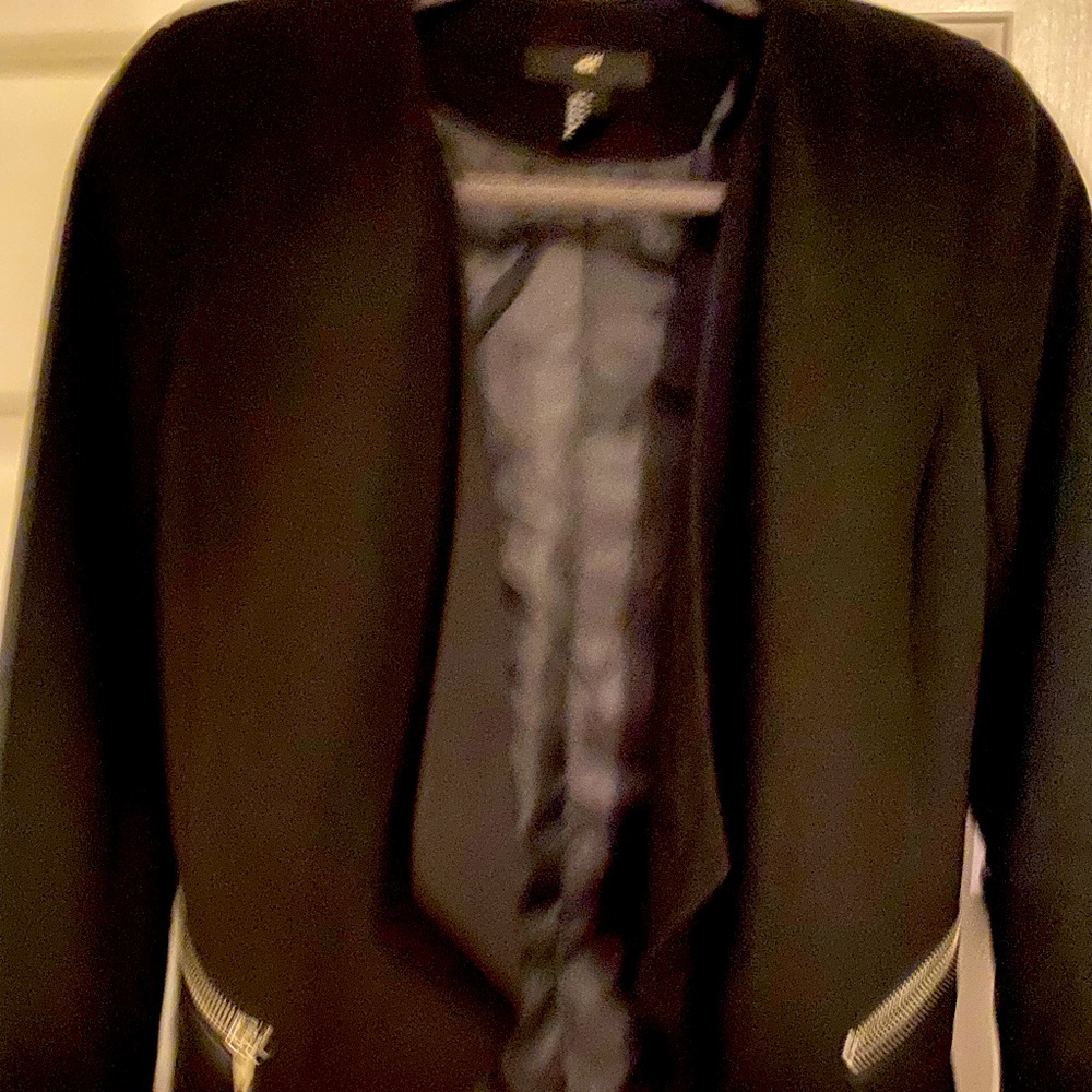 Black blazer with hip zipper pockets